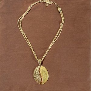 Costume Jewelry gold pendant necklace.